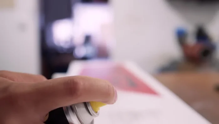 Clean the snowboard base with base cleaner and a scourer, paying attention to grimy areas. Wipe off residue with a polishing cloth.