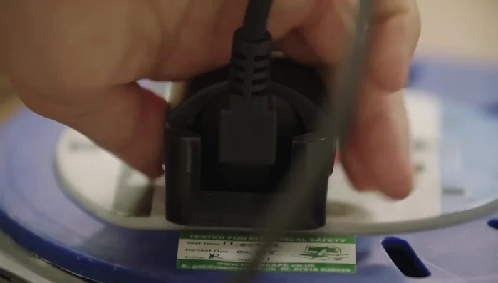 Move the iron smoothly and steadily across the snowboard base, applying wax in a zigzag pattern, ensuring even coverage. Always keep the iron moving to avoid overheating the base. Pay special attention to the edges.