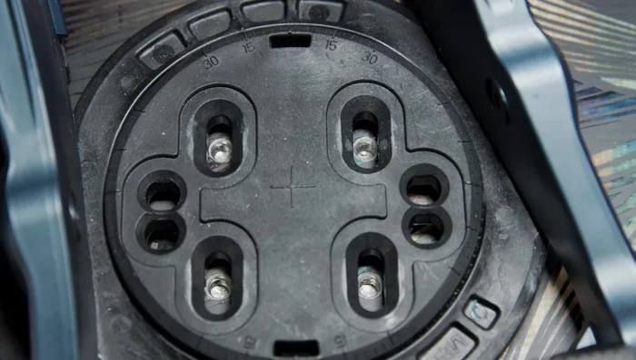 Adjust binding position if needed by loosening screws and sliding, or flipping the 4x4 disc 180 degrees.