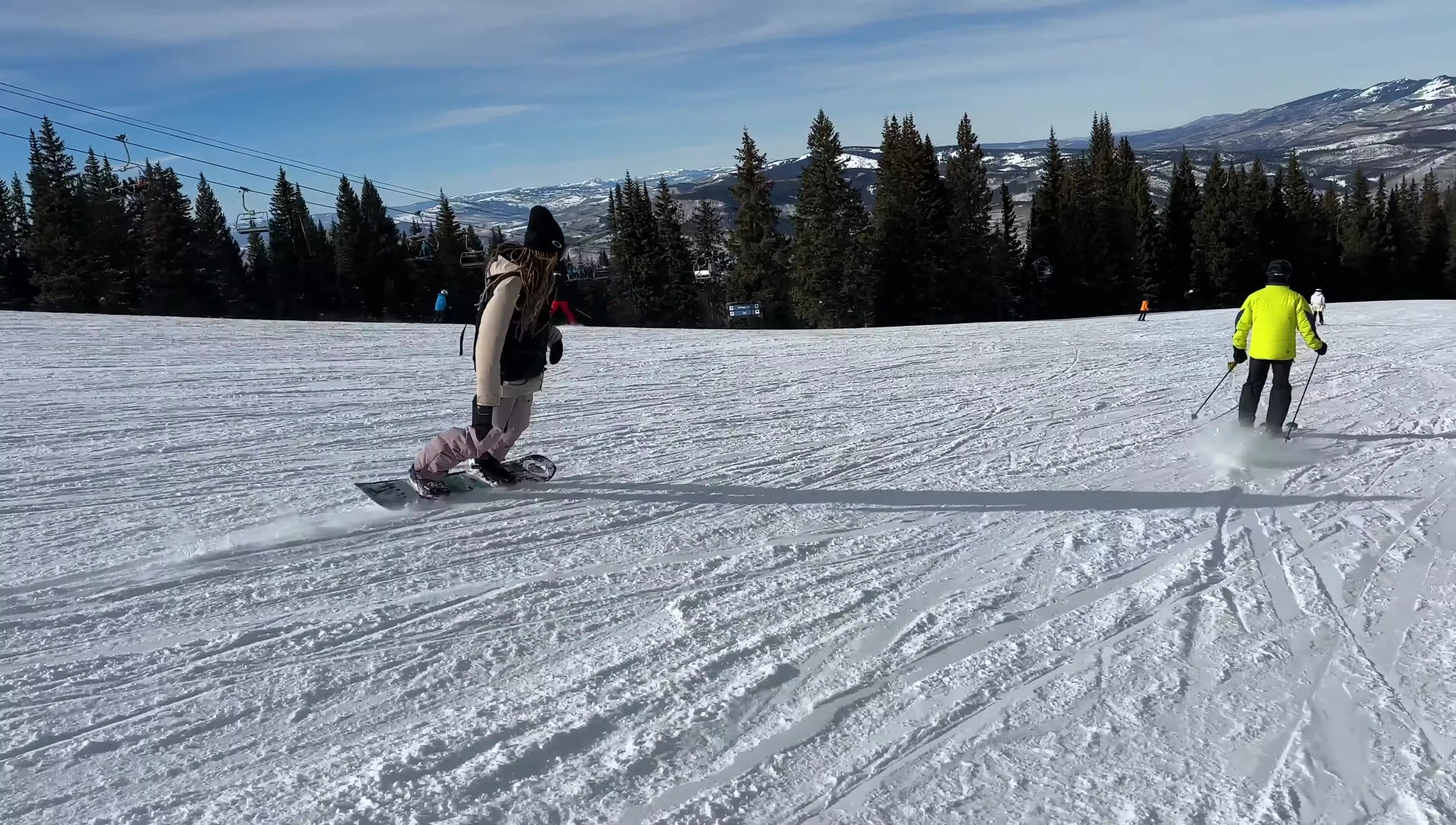 Close-up of the snowboard's base and edges