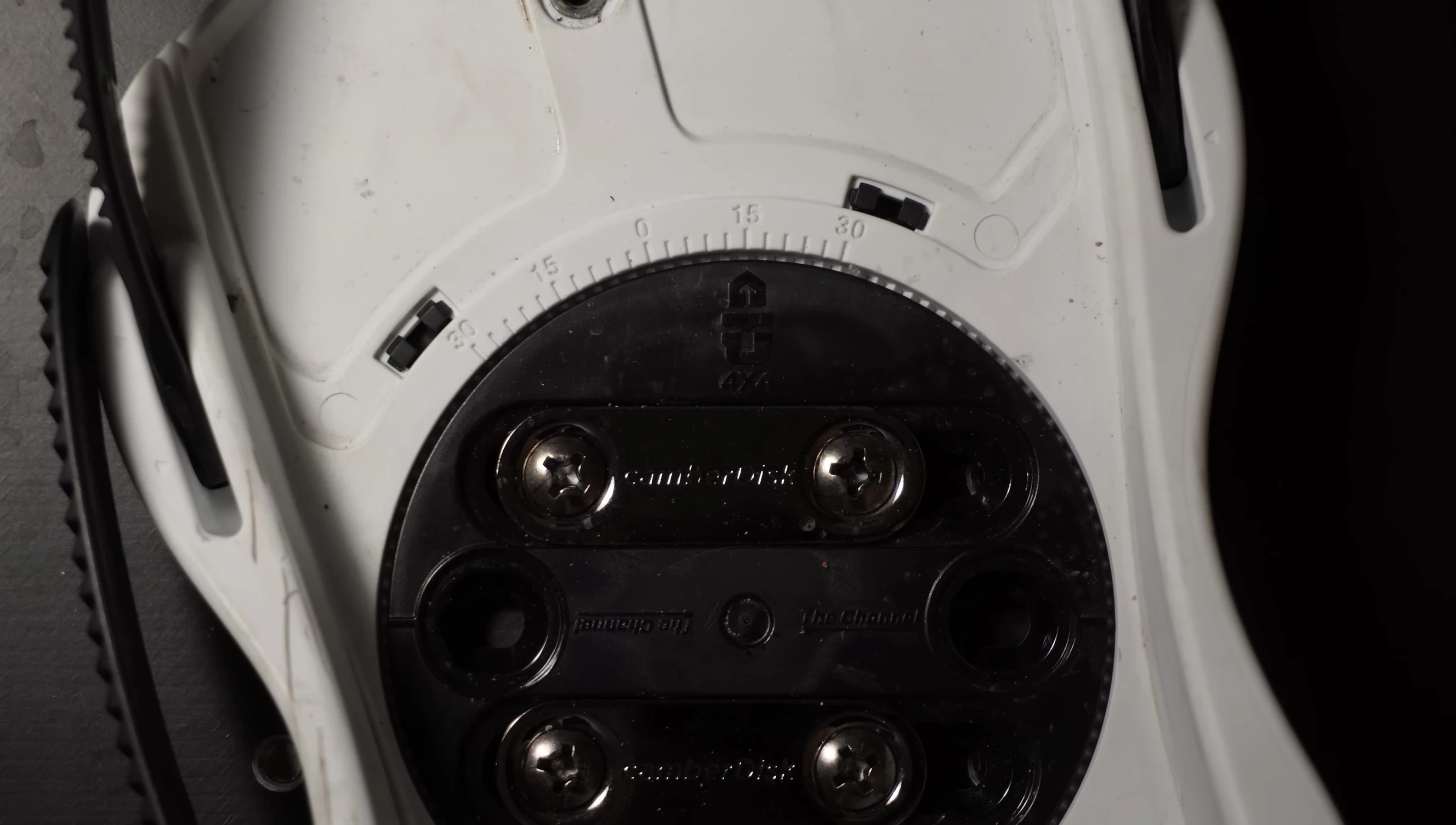 Close-up of snowboard bindings showing angle markings.