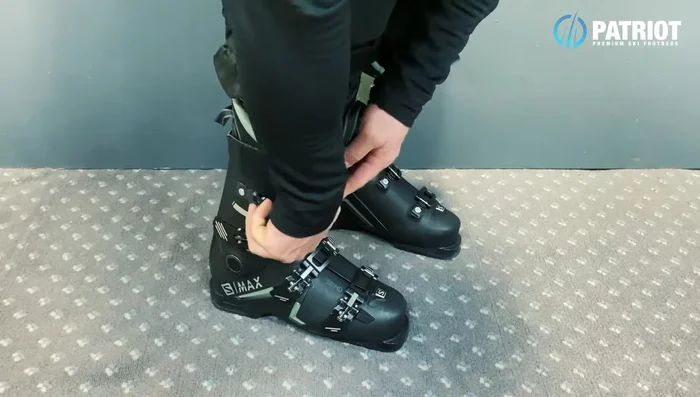 Match the tension of the top buckle to the lower cuff buckle, securing your lower leg. Avoid over-tightening to prevent cramps.