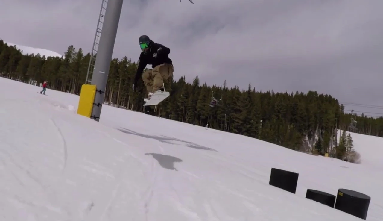 Close-up of the snowboarder testing the rocker board, demonstrating its ease of maneuverability.