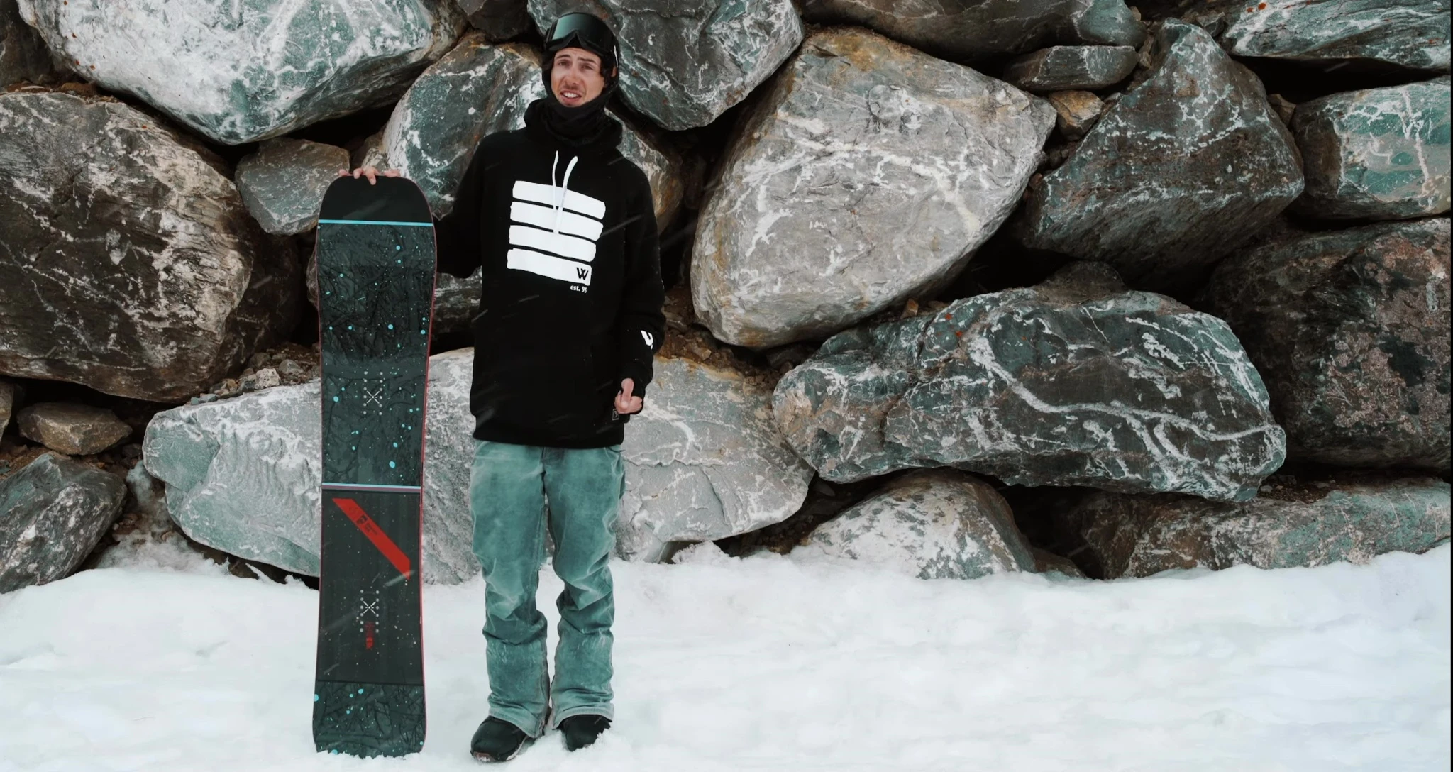 Rider enjoying the fresh powder on their Rome Ravine snowboard.