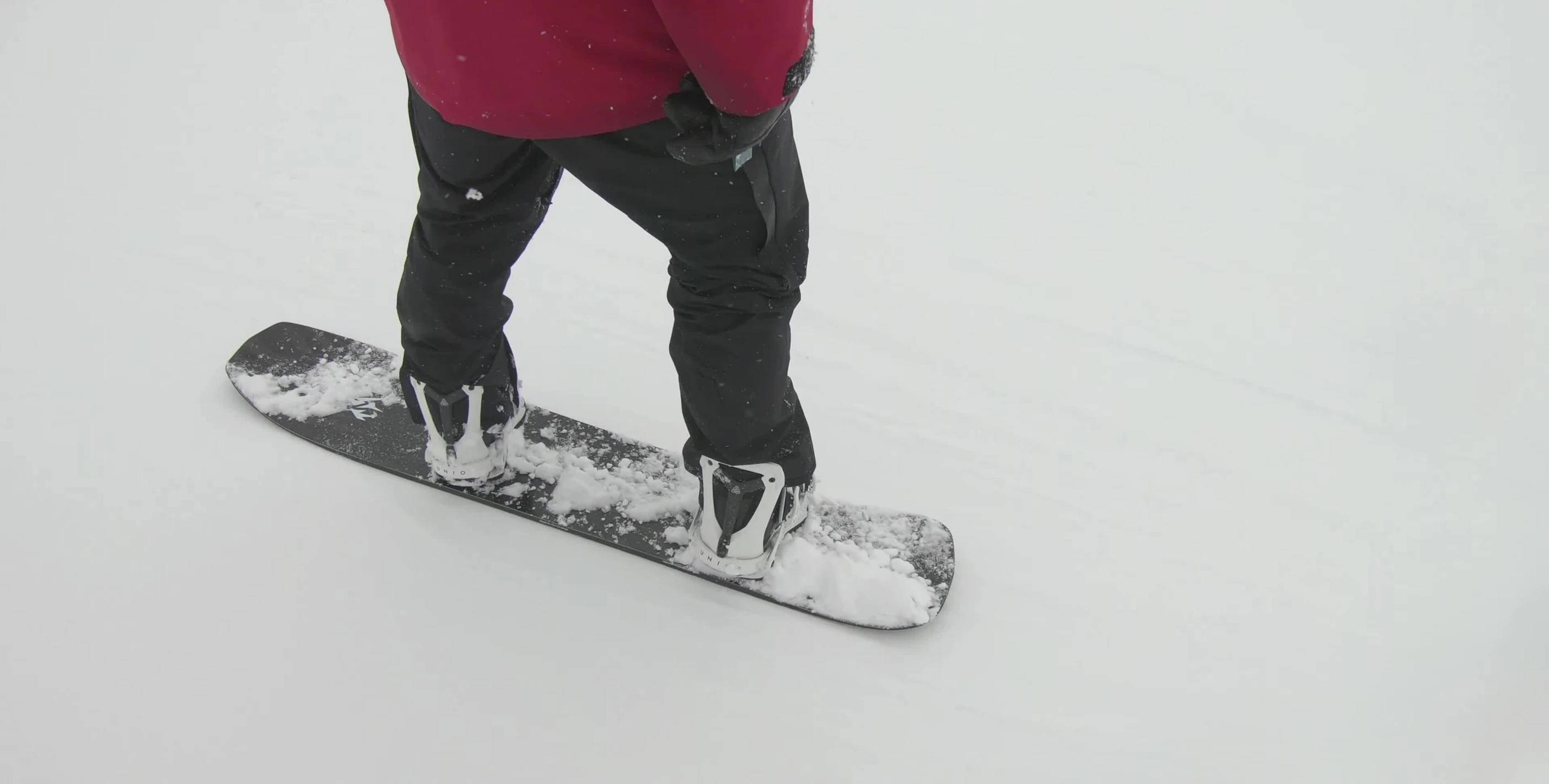 A shot of the snowboard in action, showcasing its performance in powder snow