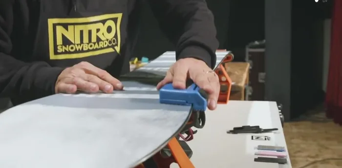 Sharpen the base edge: Use the flat side of the multi-tool and file back and forth to smooth the edge. Maintain pressure on the inside with control on the outside.