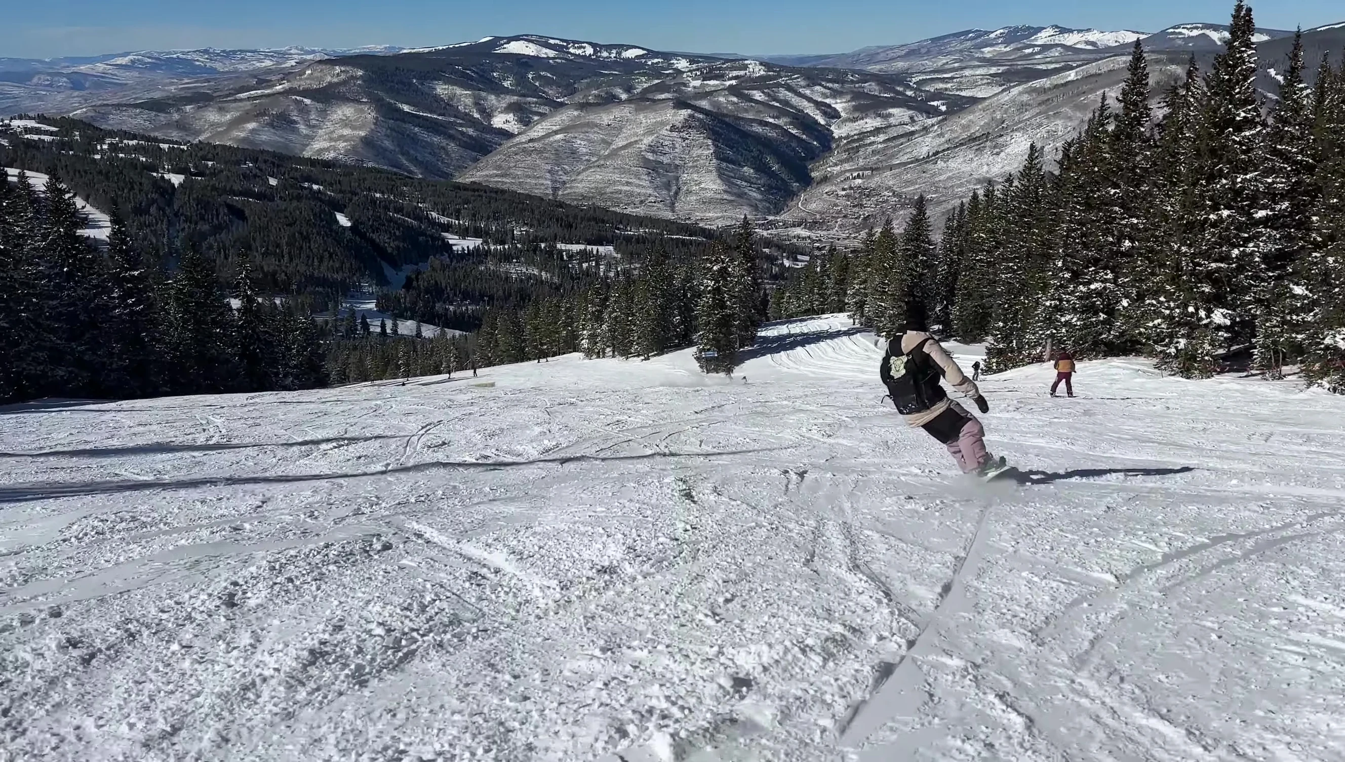 Rider carving aggressively at high speed.