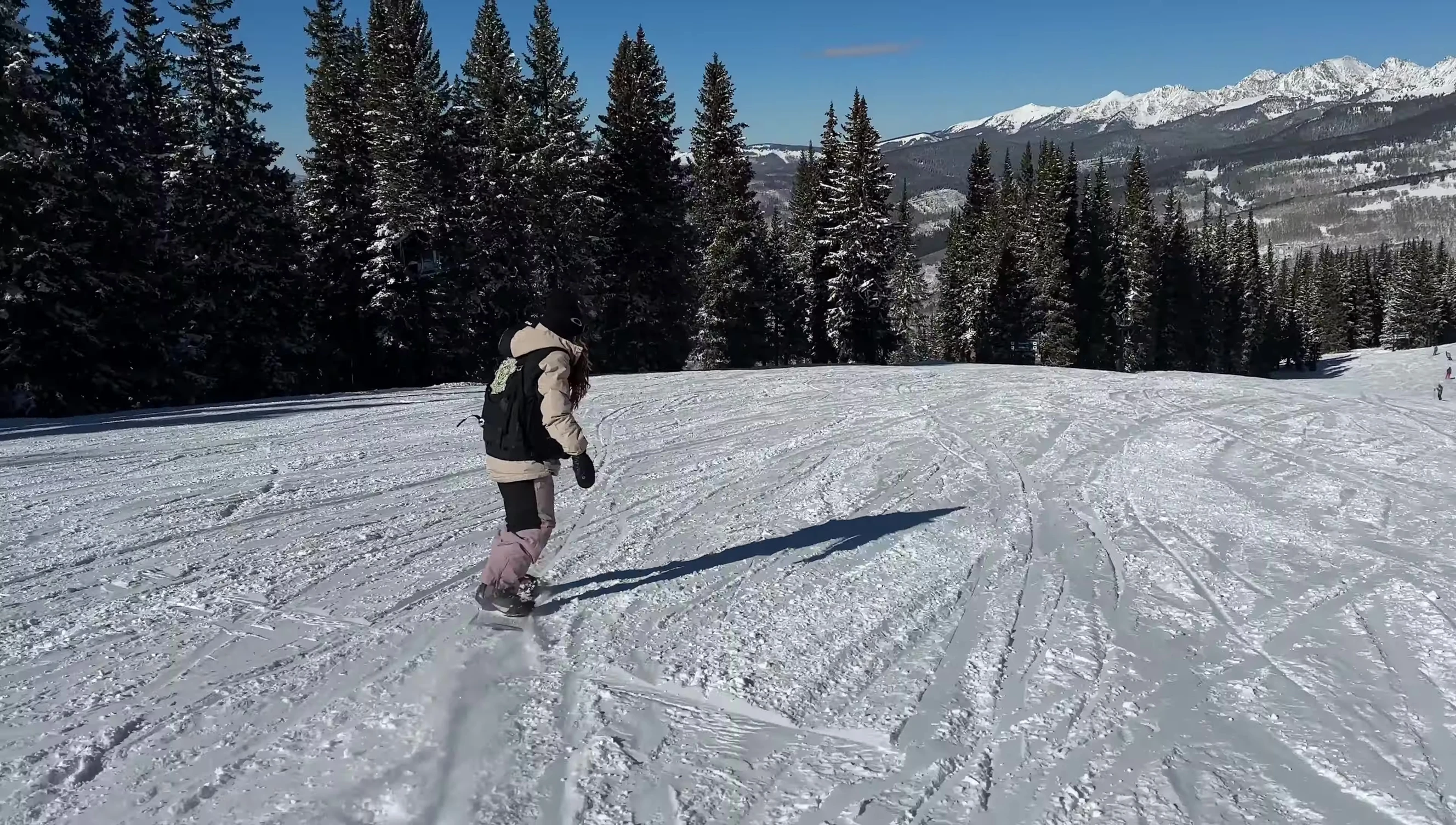 Rider navigating slightly choppy snow conditions.