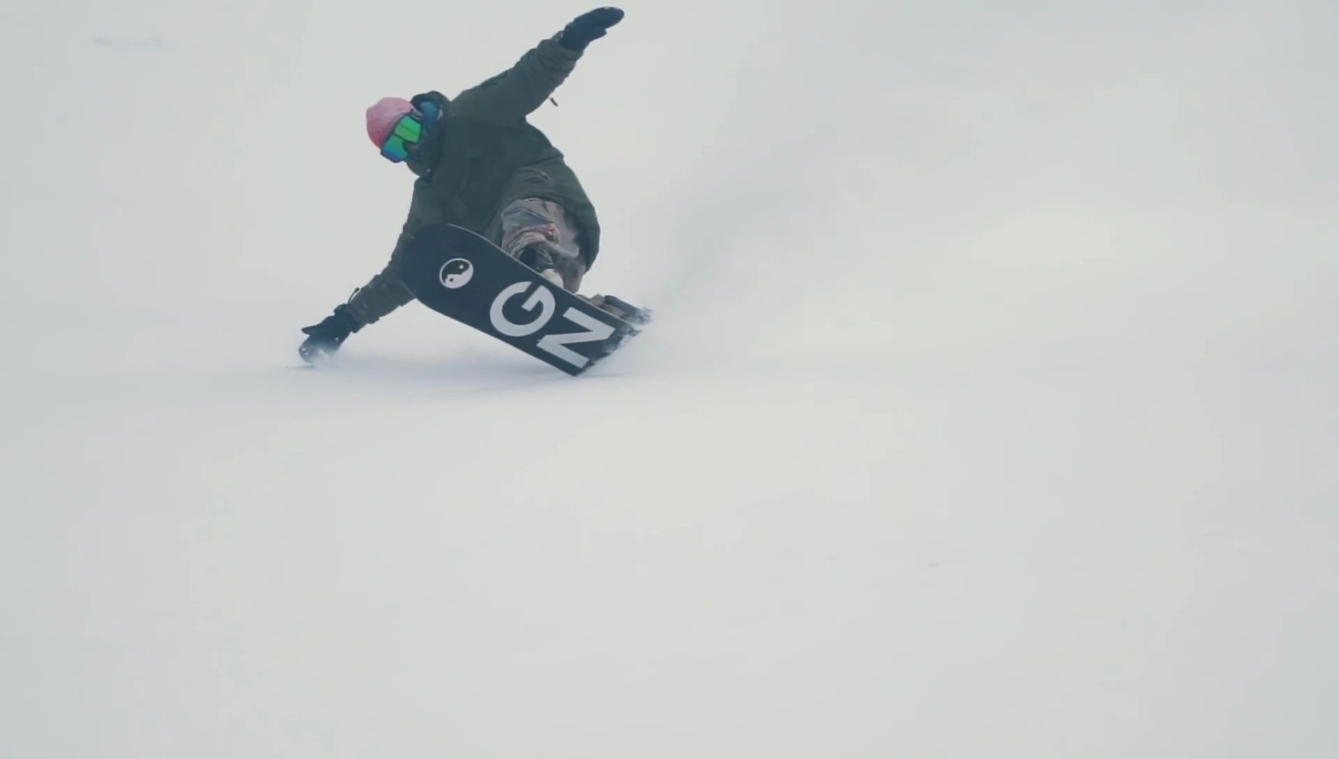 The snowboard's noticeable nose, emphasizing its design for powder.