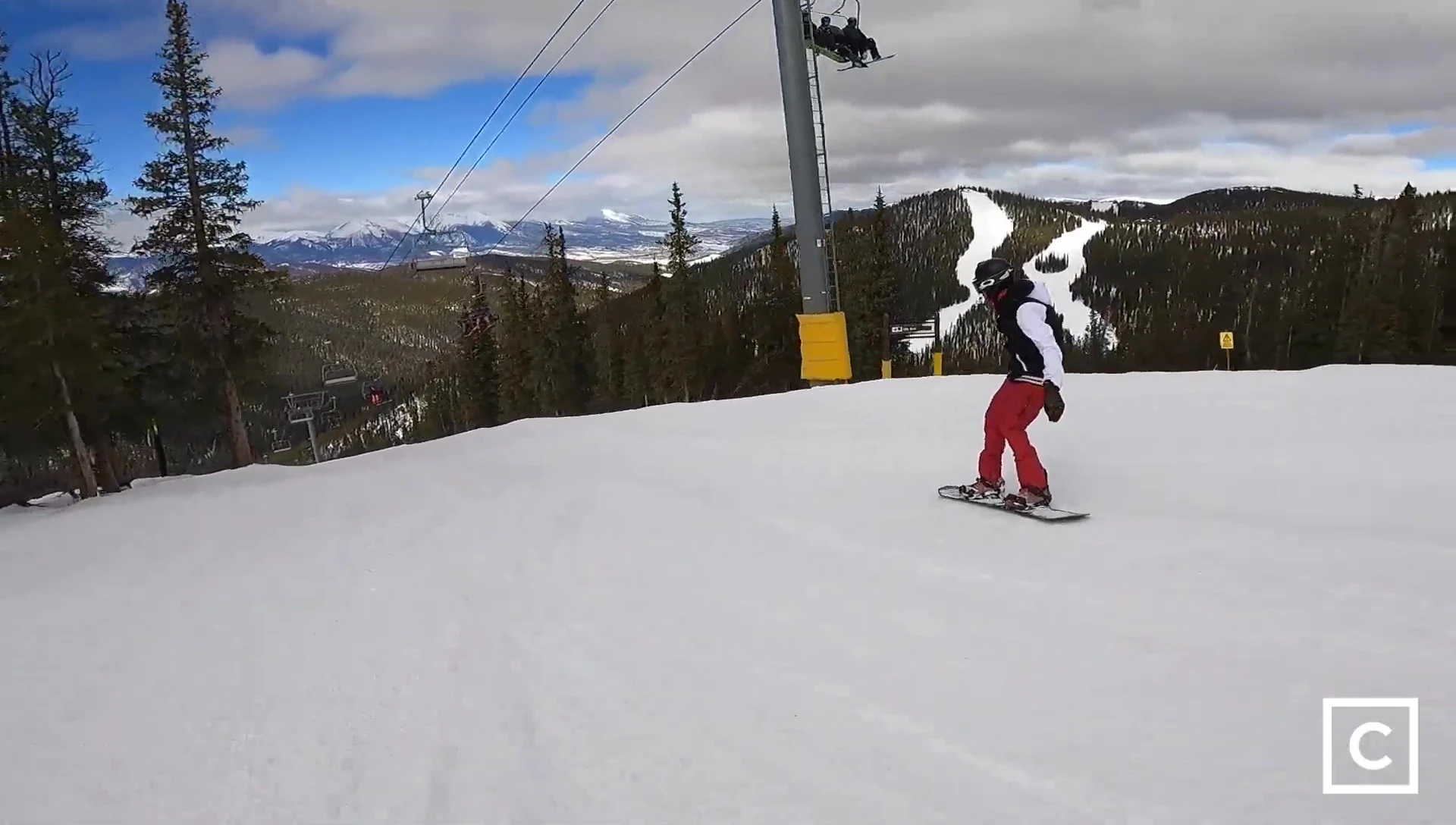 Rider confidently navigating a challenging section of the mountain.