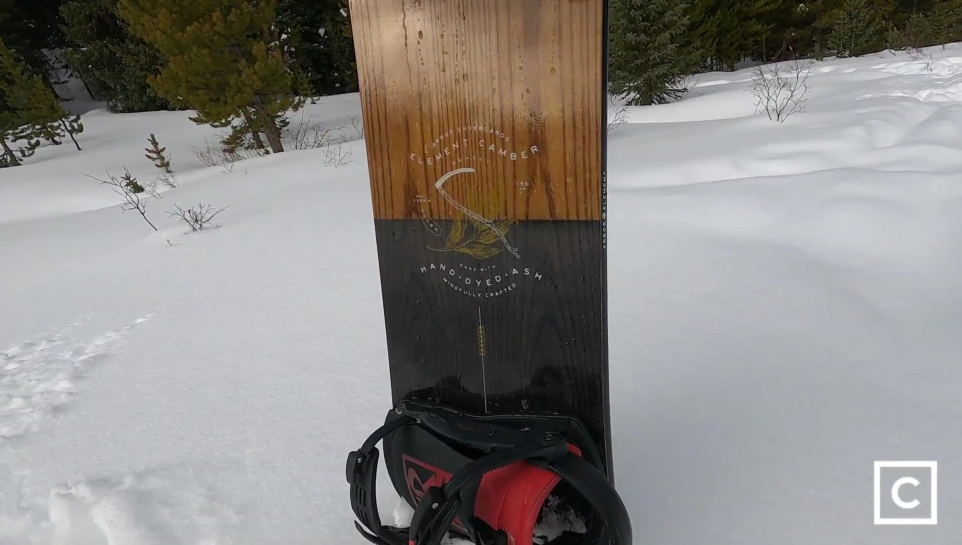 Close-up of the board's edge gripping the snow during a high-speed run.