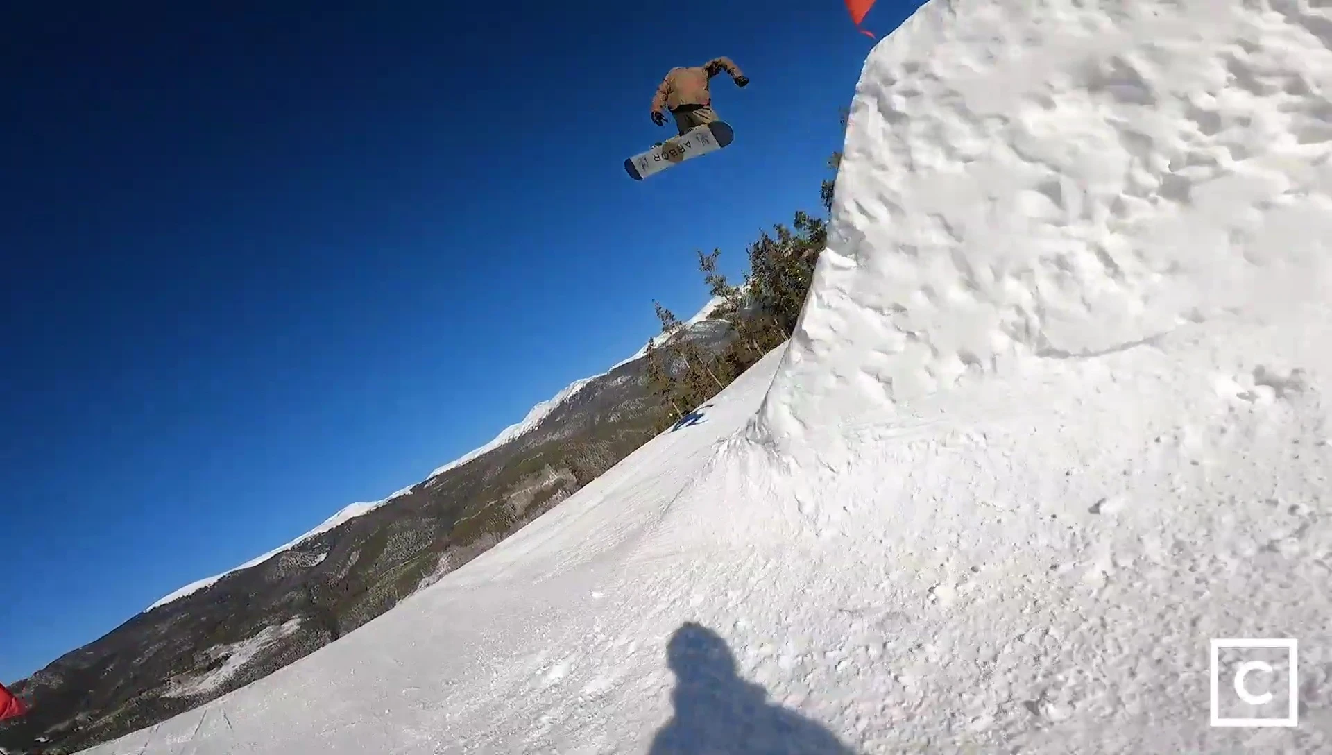 Wider shot of the rider navigating various terrain.