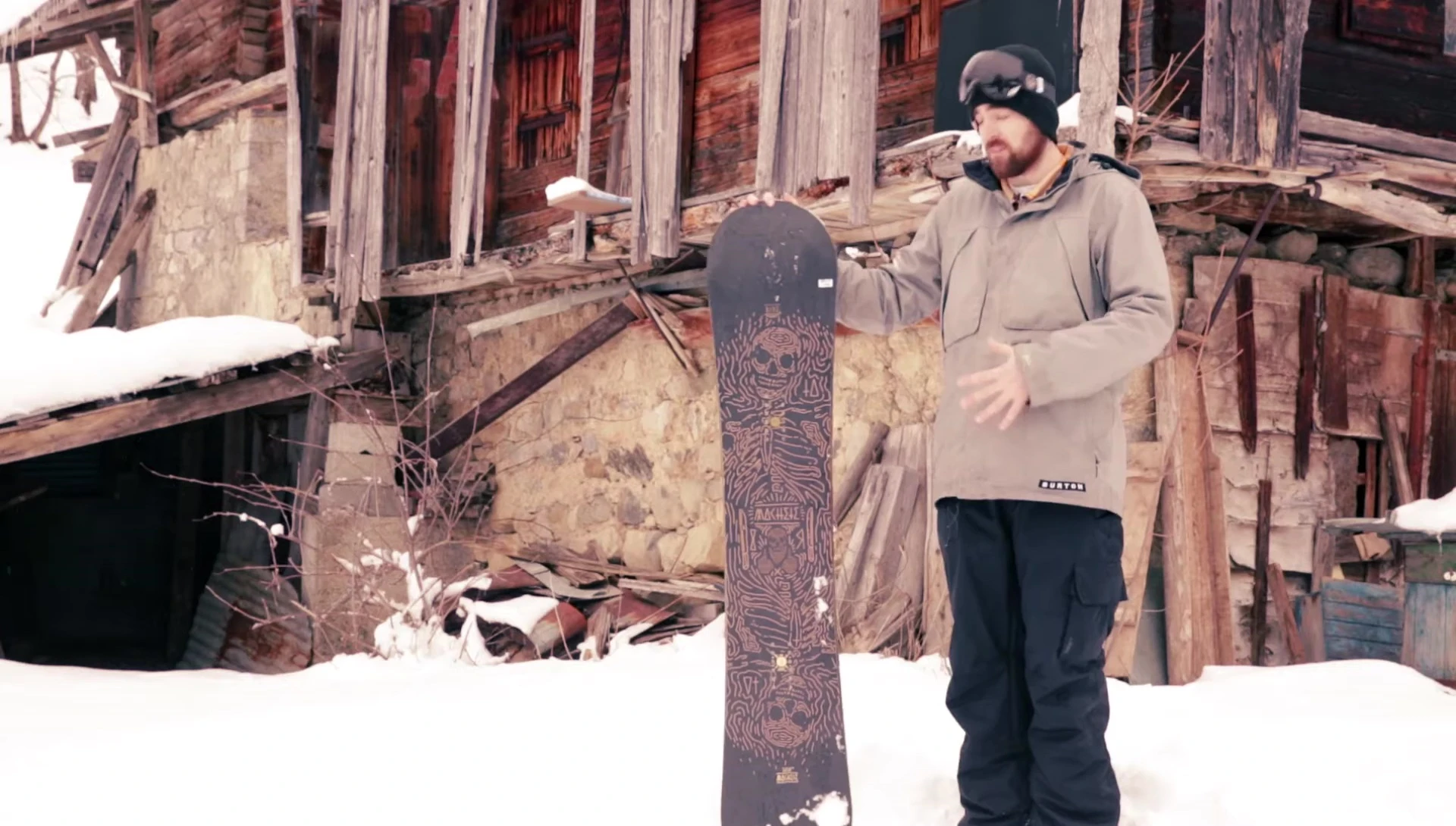 Snowboarder performing a press
