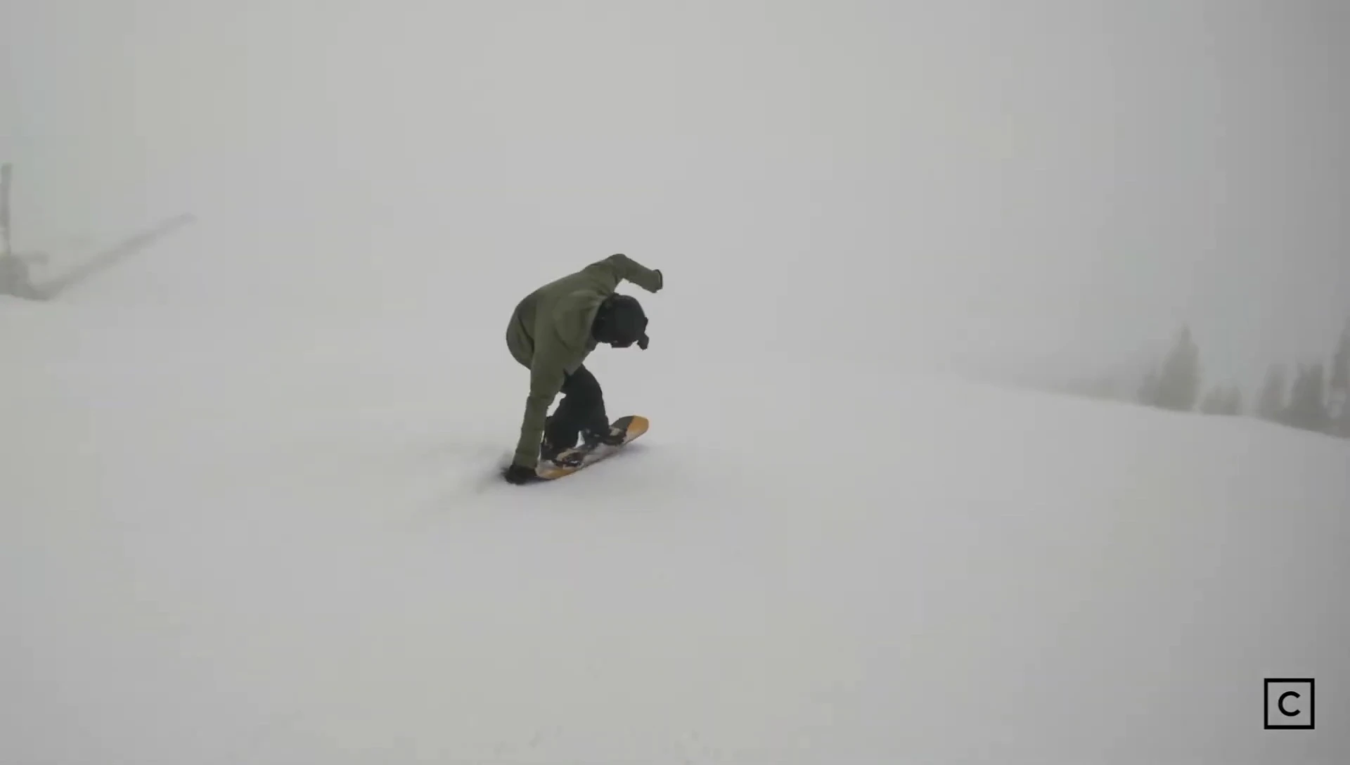 The snowboarder navigating powder snow with the Salomon Assassin.