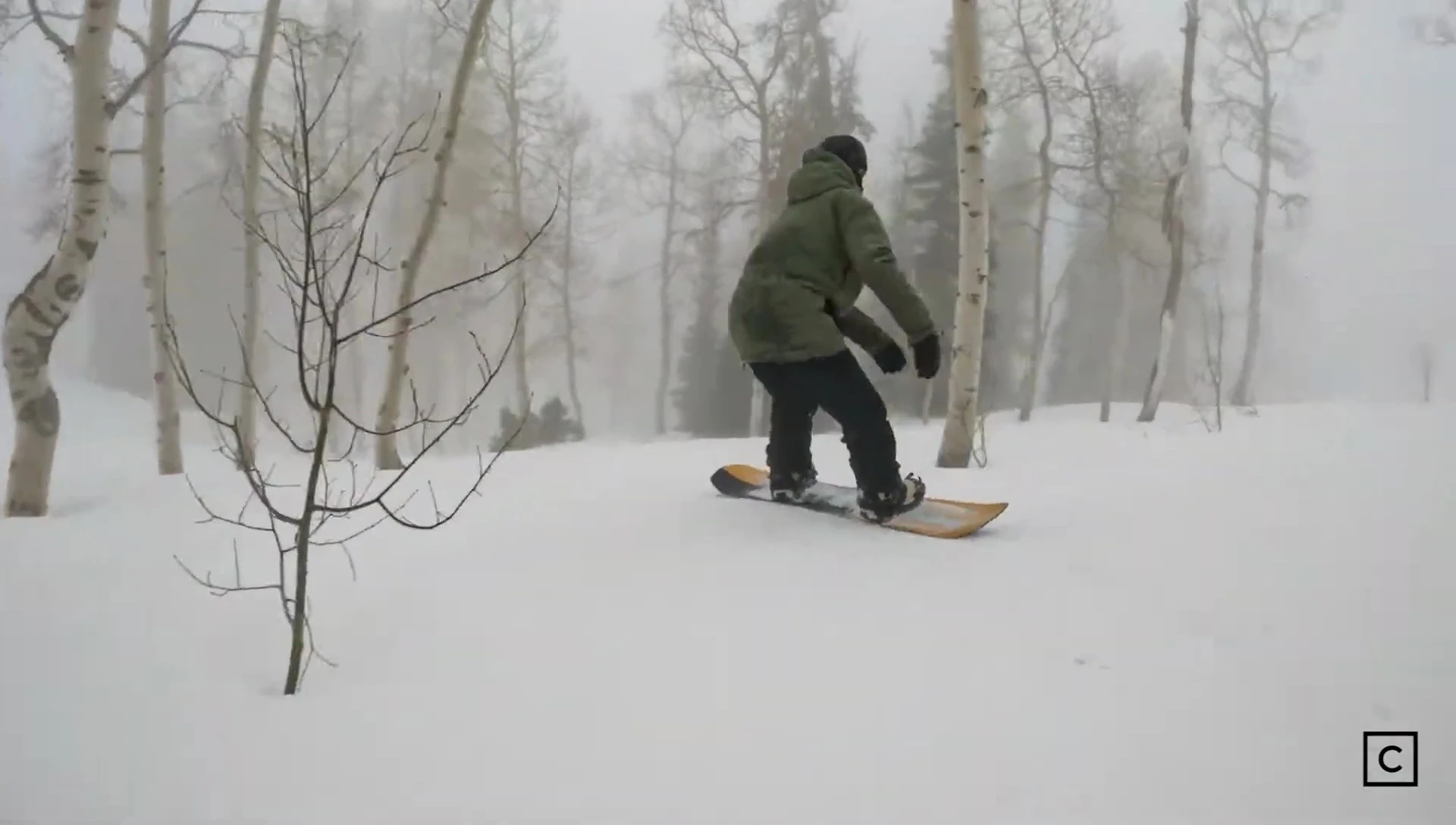 Footage of the snowboarder executing a clean jump on the Assassin.