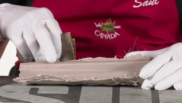 Carefully remove the mold after curing. Sand any excess filler.