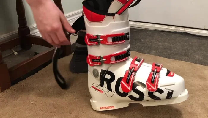 Fasten the top buckle snugly for lower leg support and forward shin pressure.