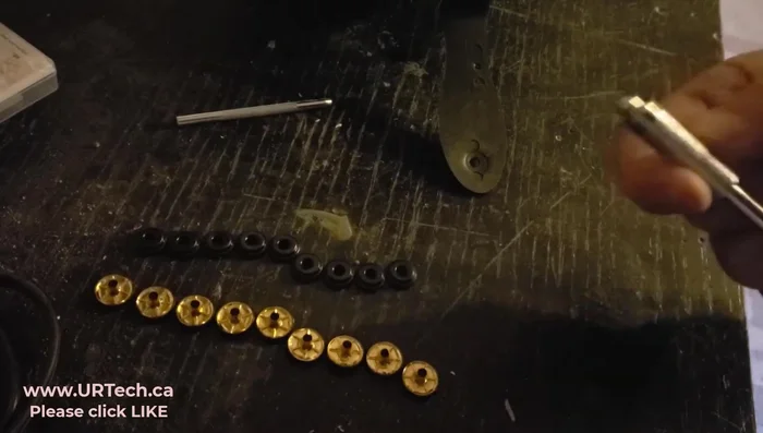 If you don't have a pre-existing hole, use a punch tool from your kit or a drill to create a hole in the helmet where the snap will go.