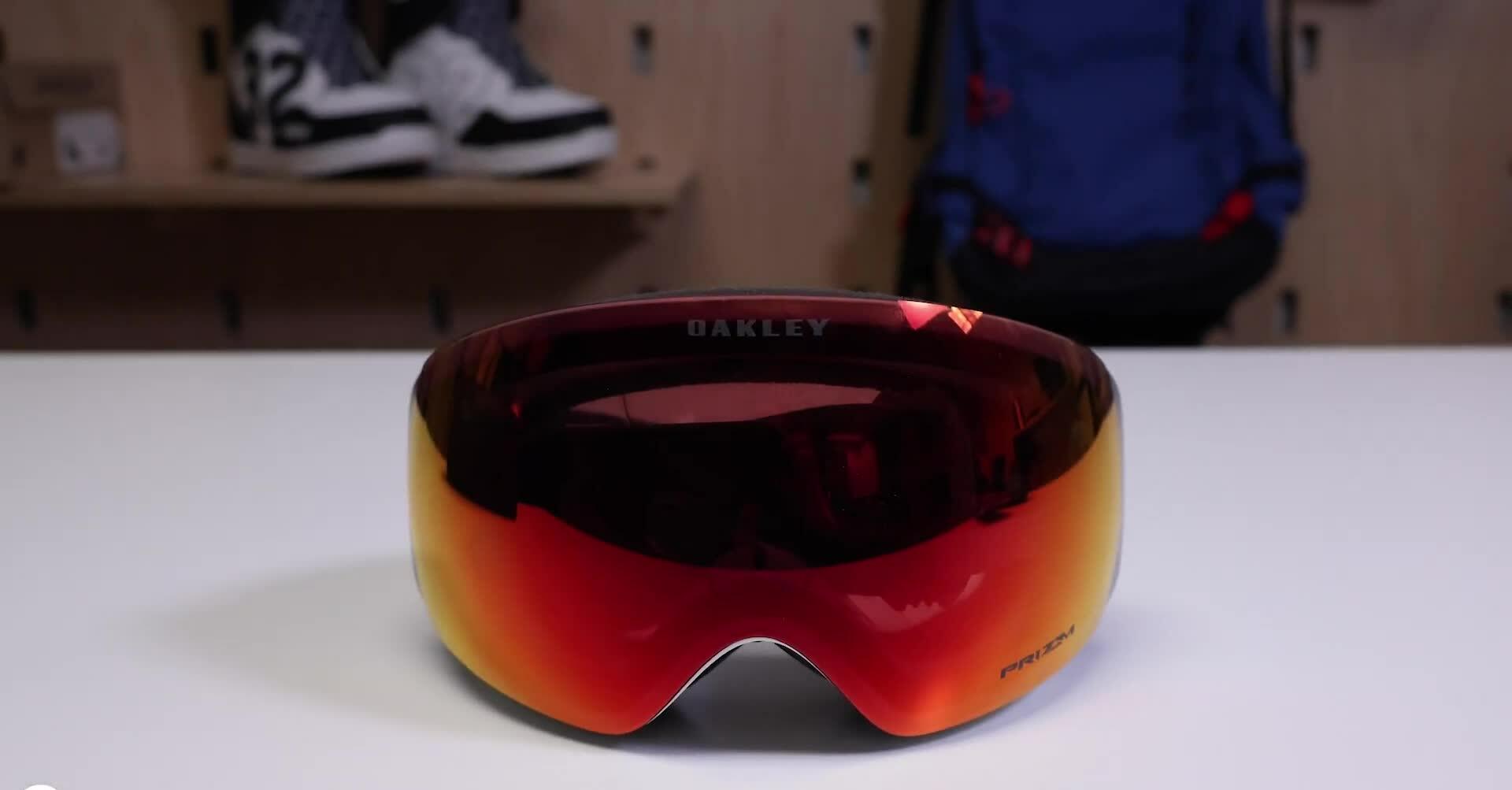 Close-up of the Oakley Flight Deck goggles showing the spherical lens wrapping around the frame.
