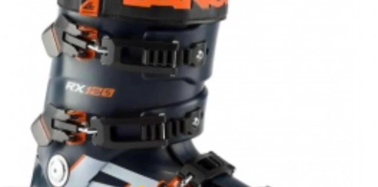 A skier demonstrating the performance capabilities of the Lange RX 120