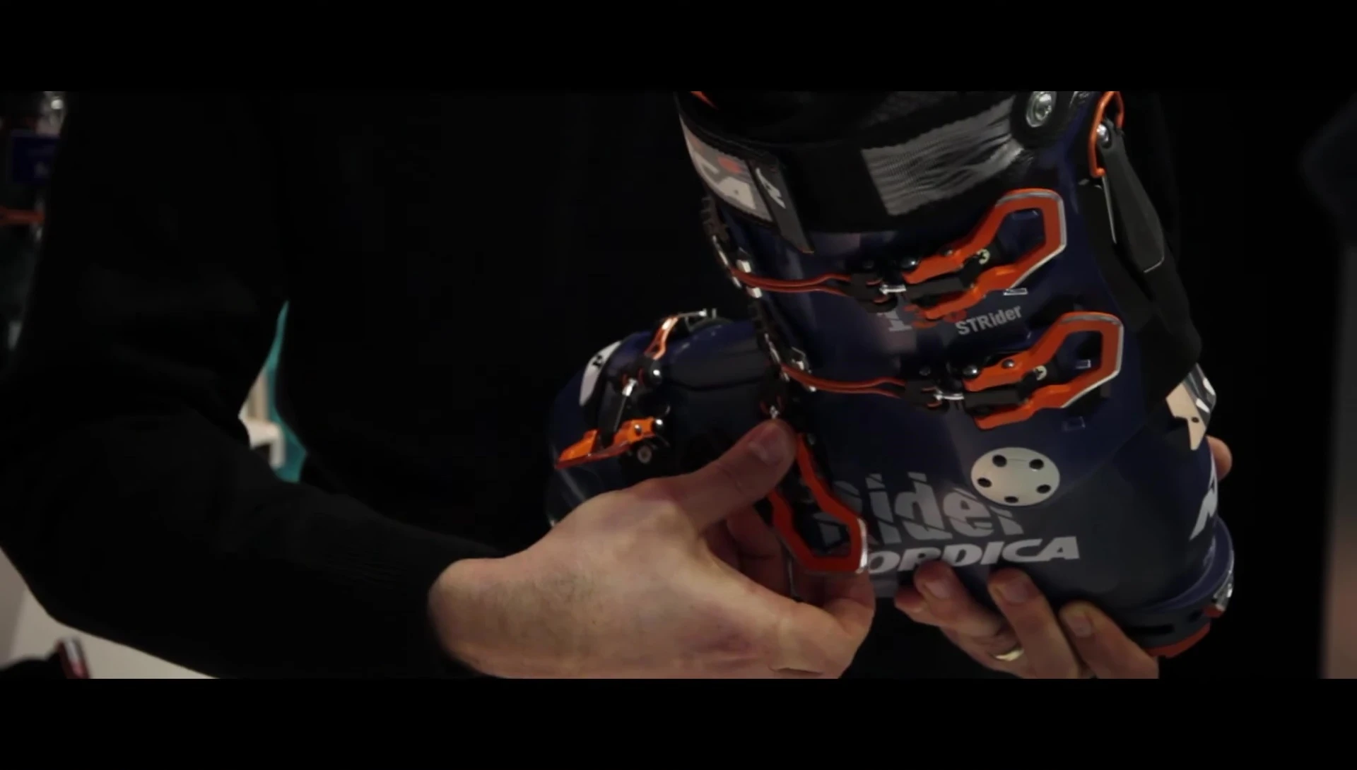 Detailed view of the boot's unique buckle system.