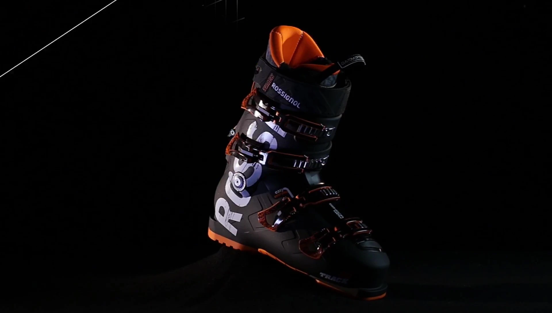 A person easily stepping into the Track ski boot, emphasizing its ease of entry.