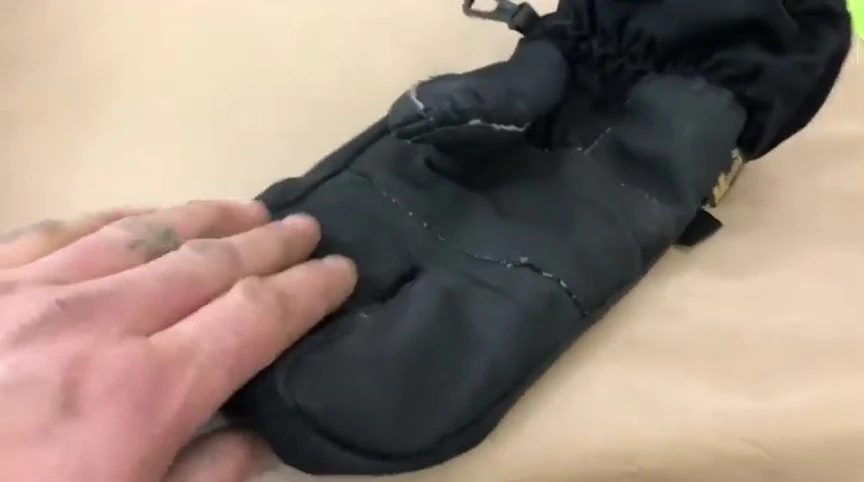 Close-up of the Kombi glove material, showcasing its durability.