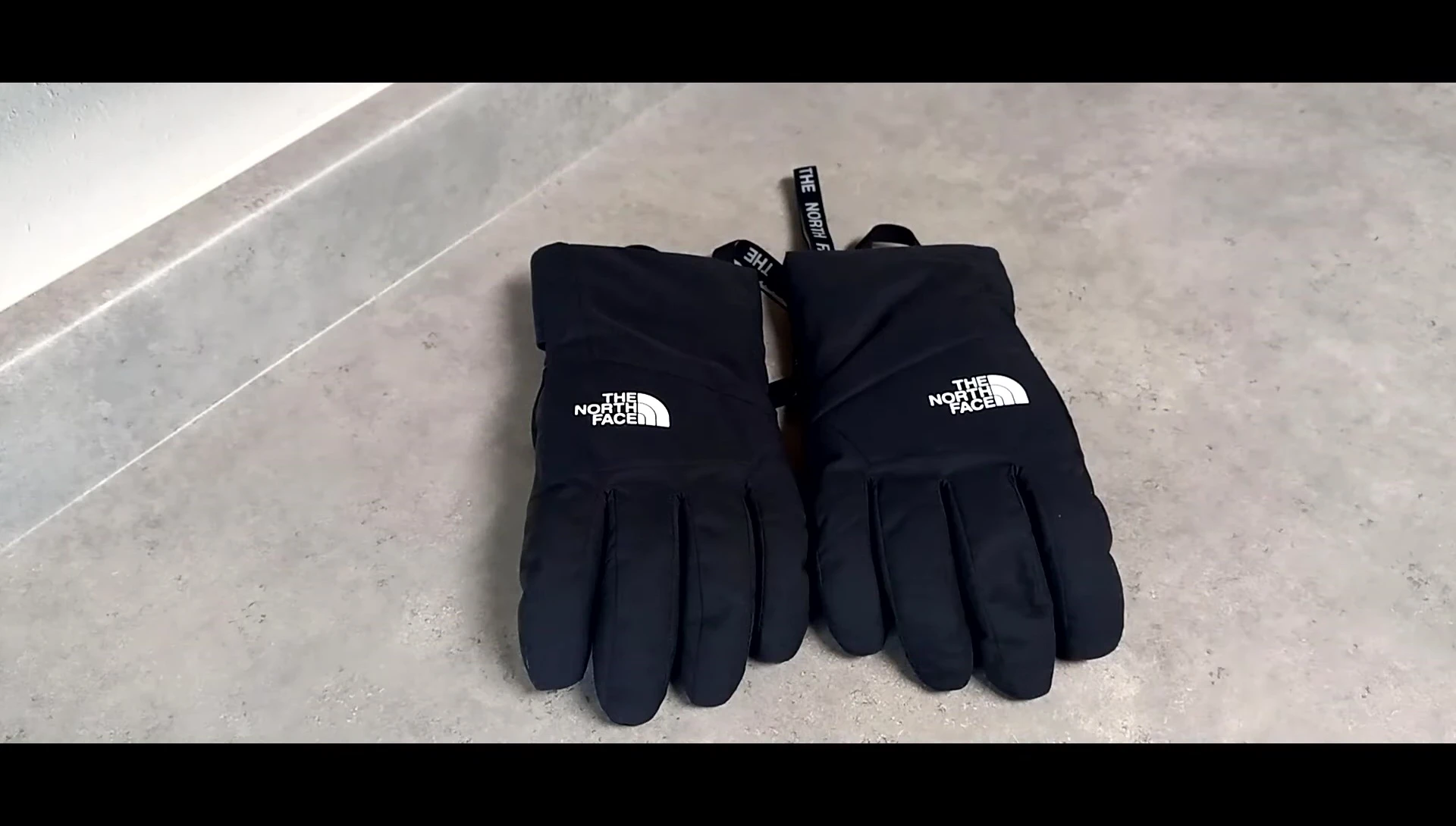 Image comparing the speaker's gloves with the current model shown on a website or catalog.