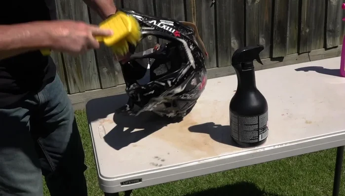 If your helmet is heavily muddied, hose off the mud first.
