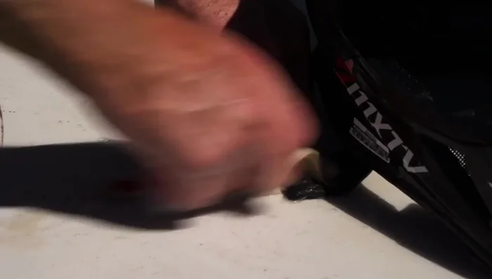 Spray the chin strap with a cleaner, focusing on stain removal. Use a soft brush to scrub the helmet and a nail brush for stubborn areas.