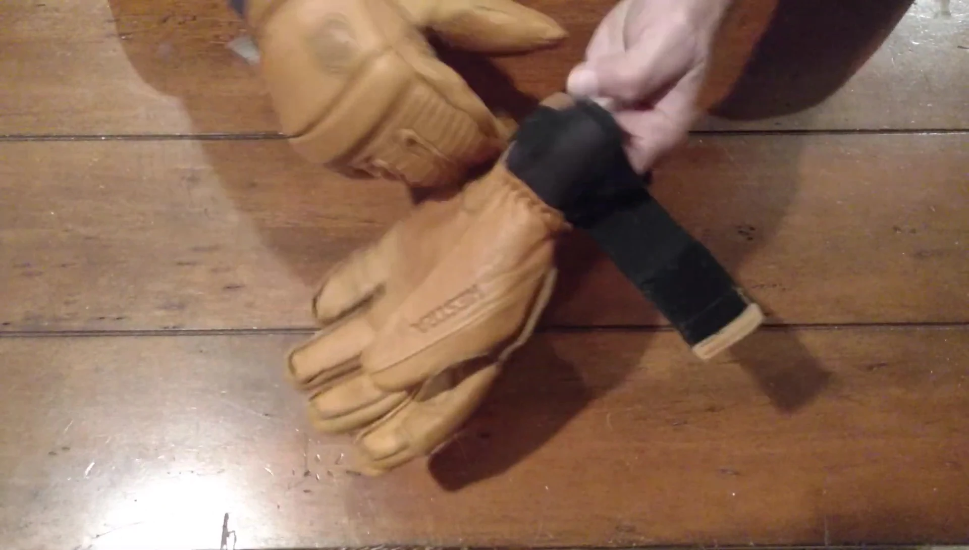 The reviewer discussing the intended use of the gloves