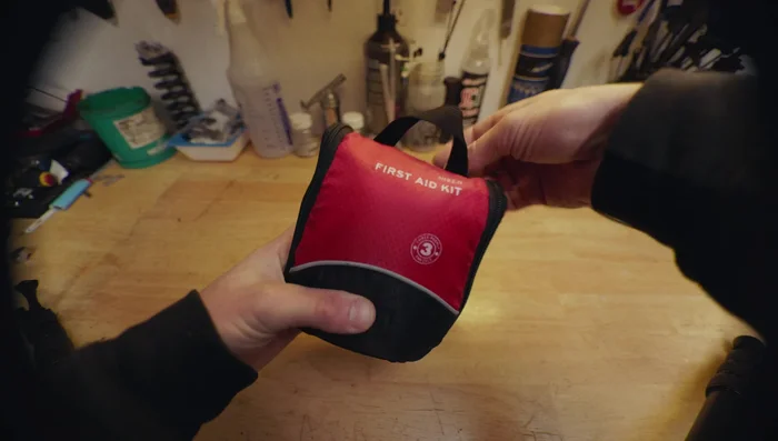 Assemble a basic repair kit with string, zip ties, and a bicycle inner tube (for fire starting).