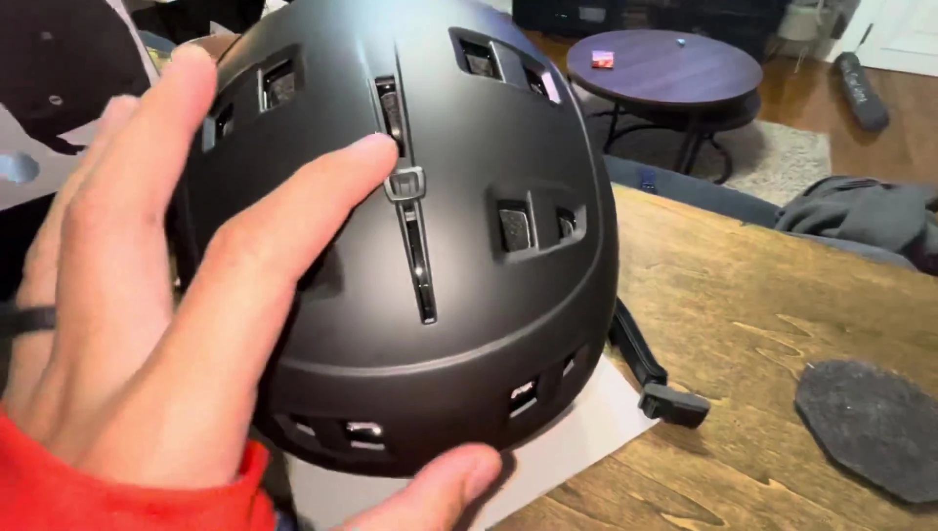 Close-up shot demonstrating the one-click vent adjustment mechanism.