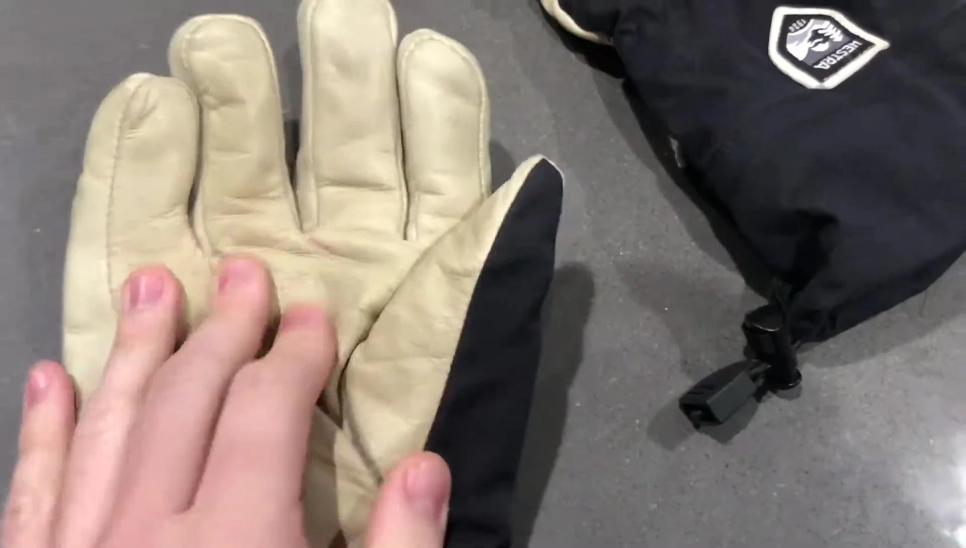 Close-up of the glove material, highlighting the leather and other fabric components.