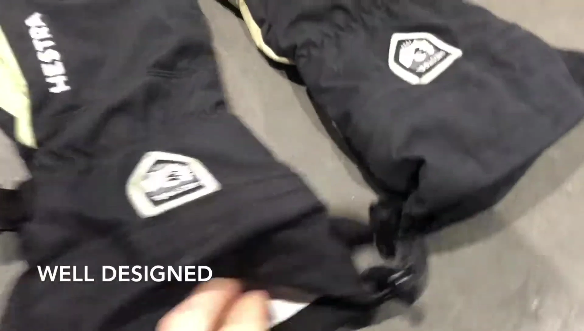 Demonstration of tucking the gloves under a jacket.