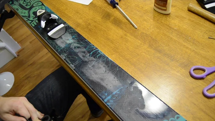 Repeat steps 10-11 for the back binding. Use a rubber band to hold the brake out of the way.