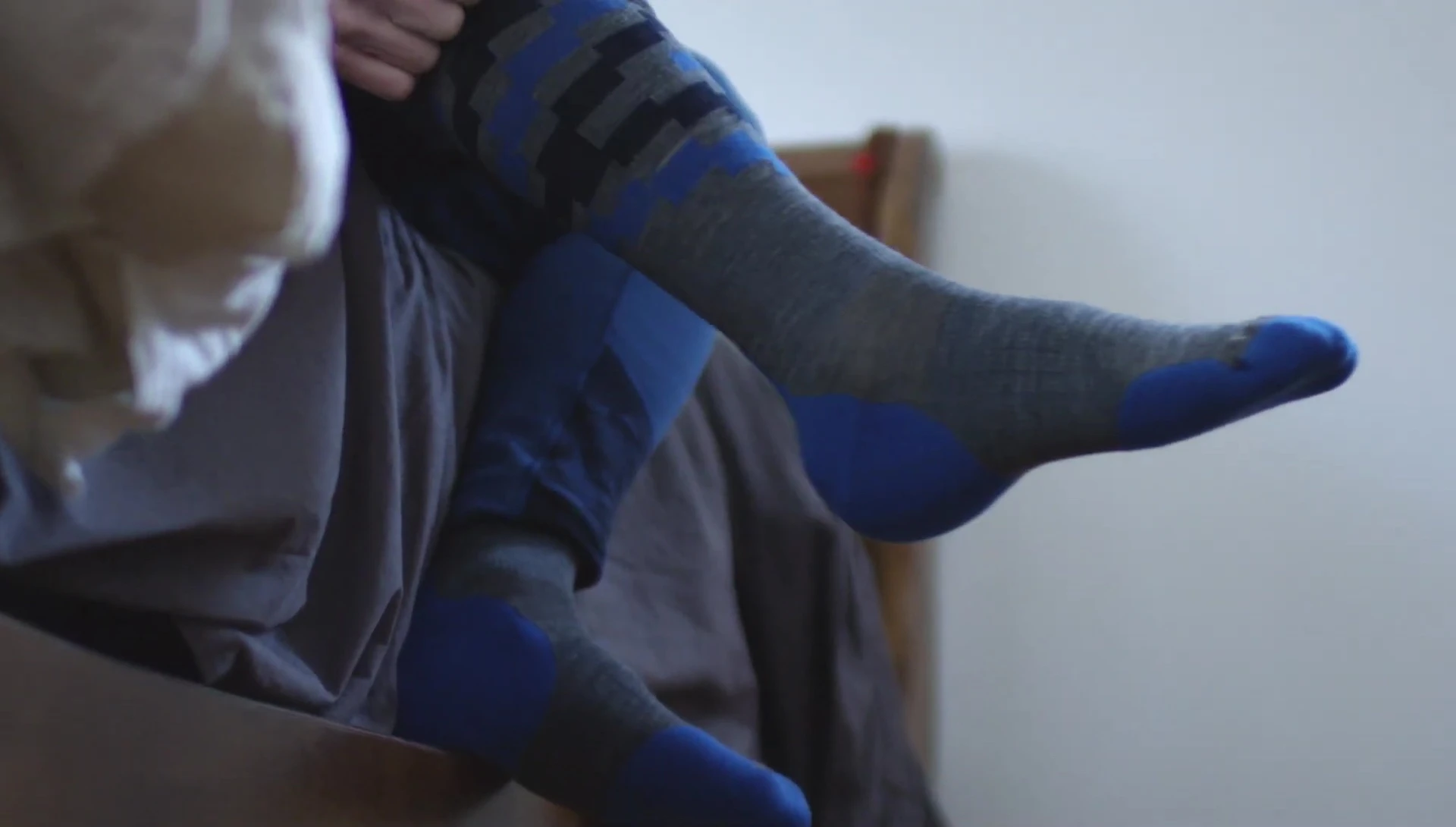 Overall shot of various socks and skiers.