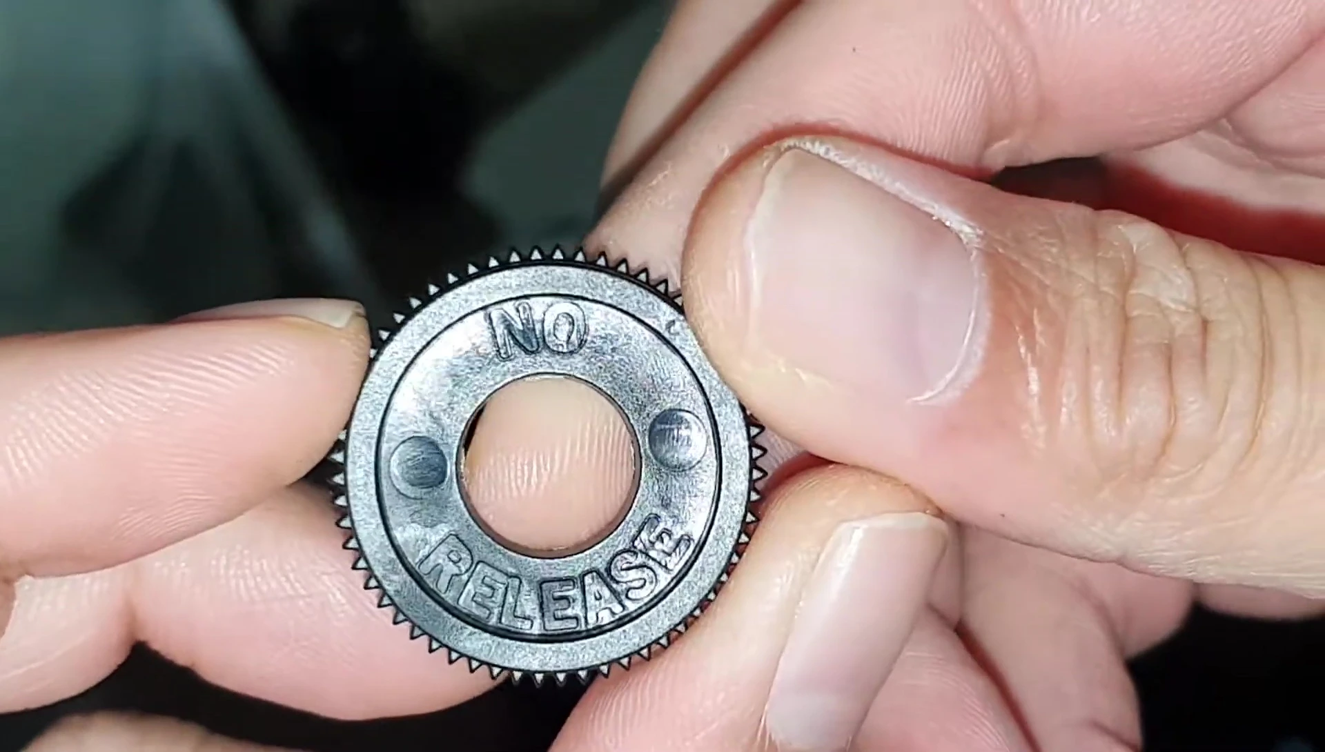 Close-up shot identifying the 'no-release' ring.