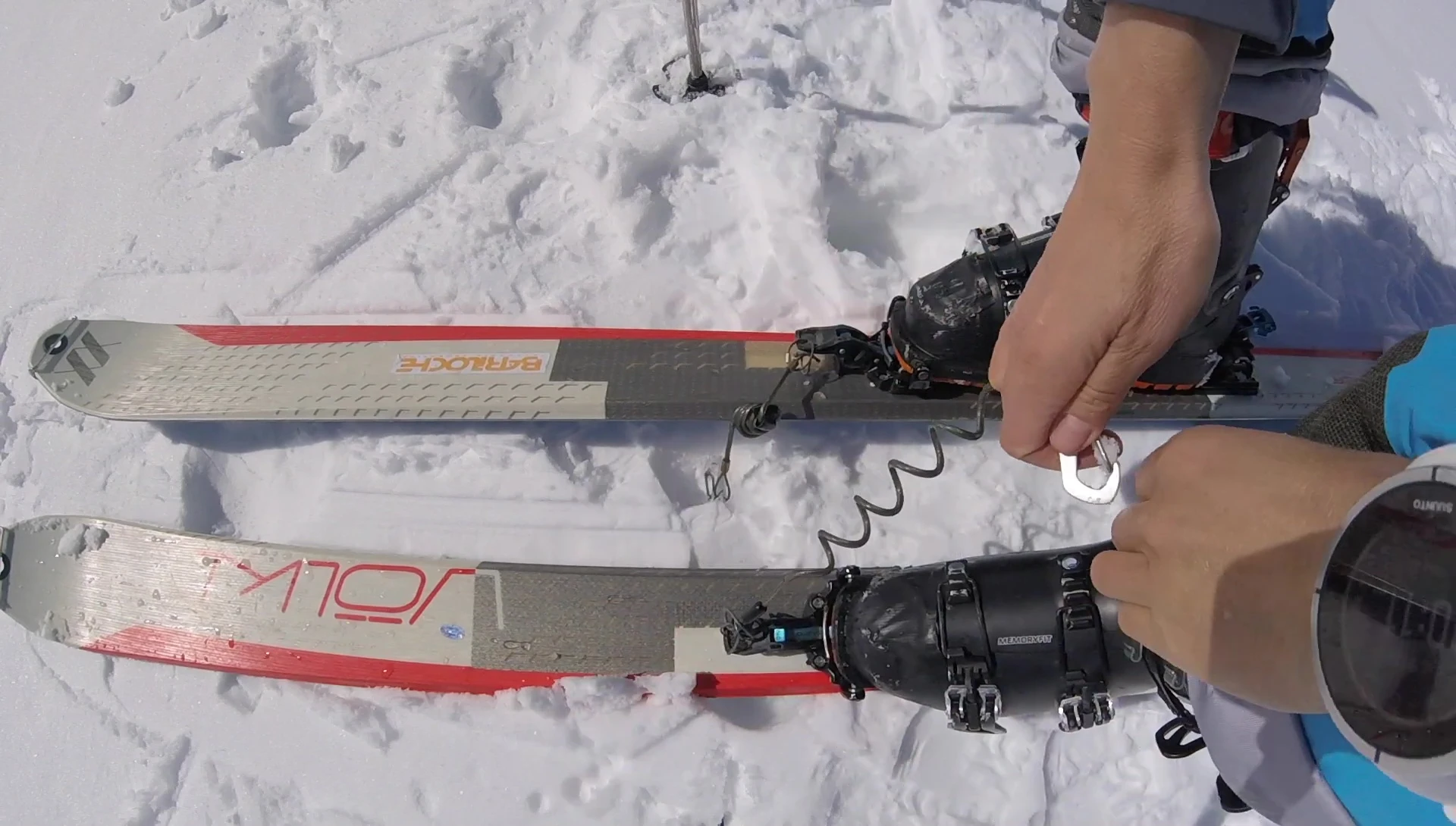 Demonstrating how to attach the leash or use brakes