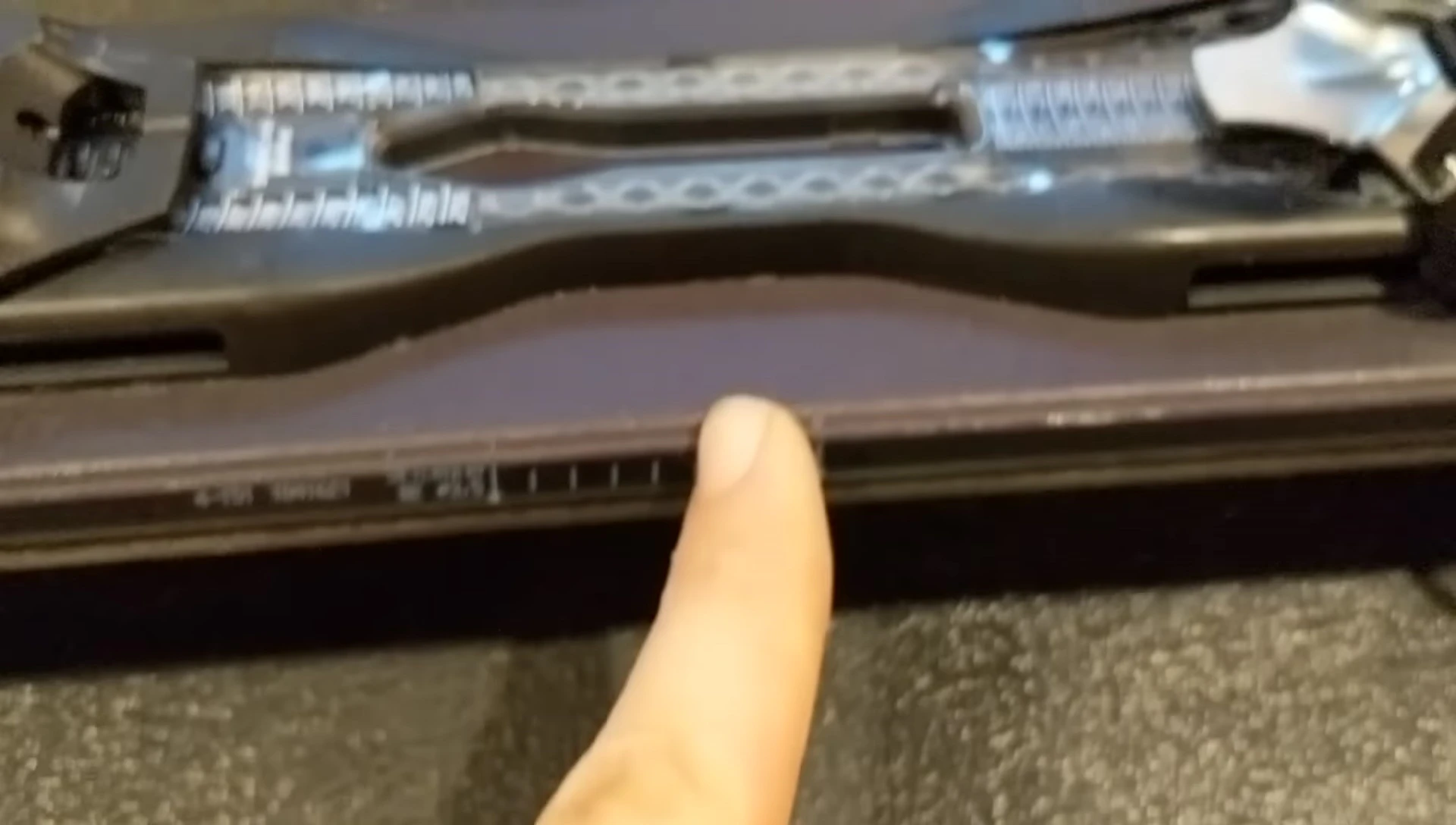 Aligning the boot center with the marked center point on the ski.