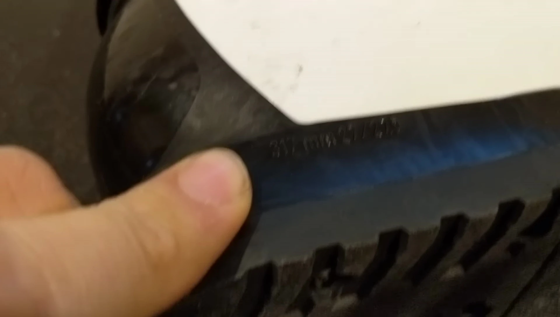 Measuring the boot length in millimeters.