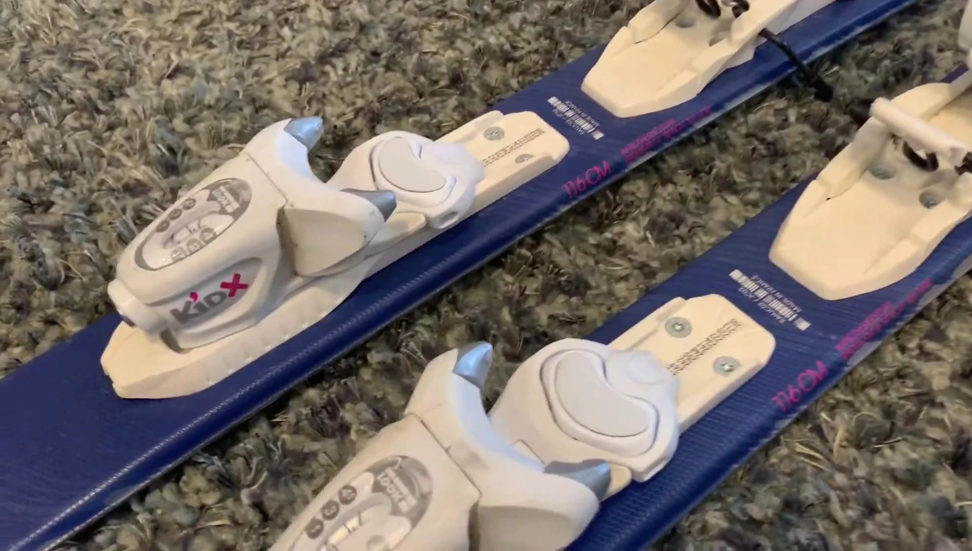 The bindings mounted on the skis.
