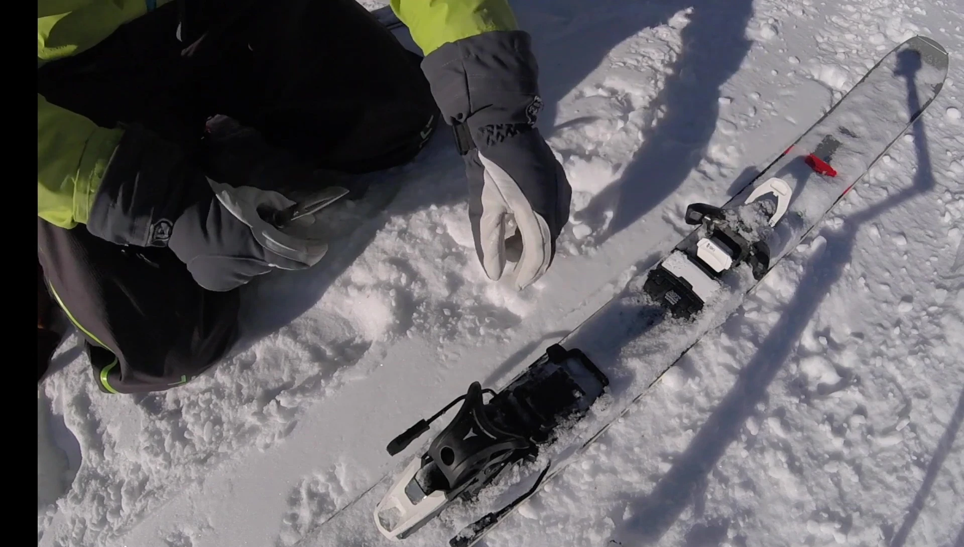 Shot highlighting snow accumulation in the binding.