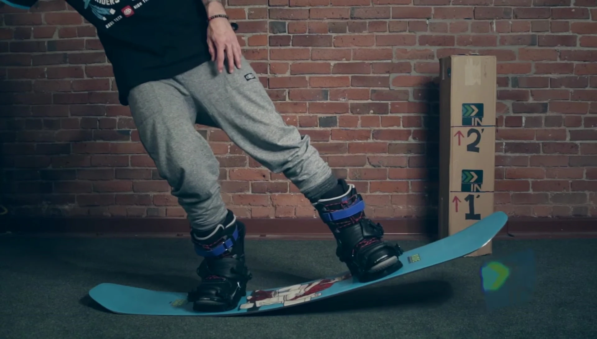 Close-up showing the board's flex with body weight applied.