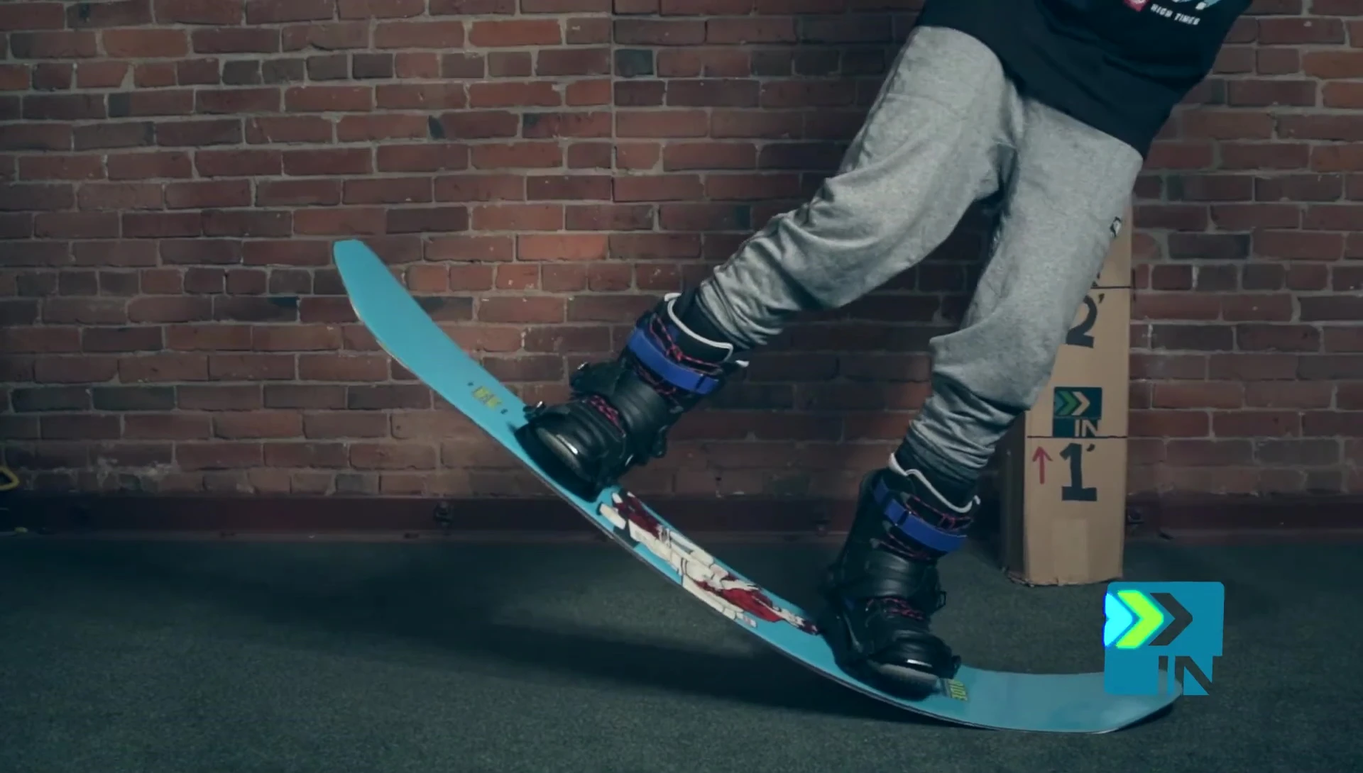 The reviewer flexing the board with more force, showing its response.