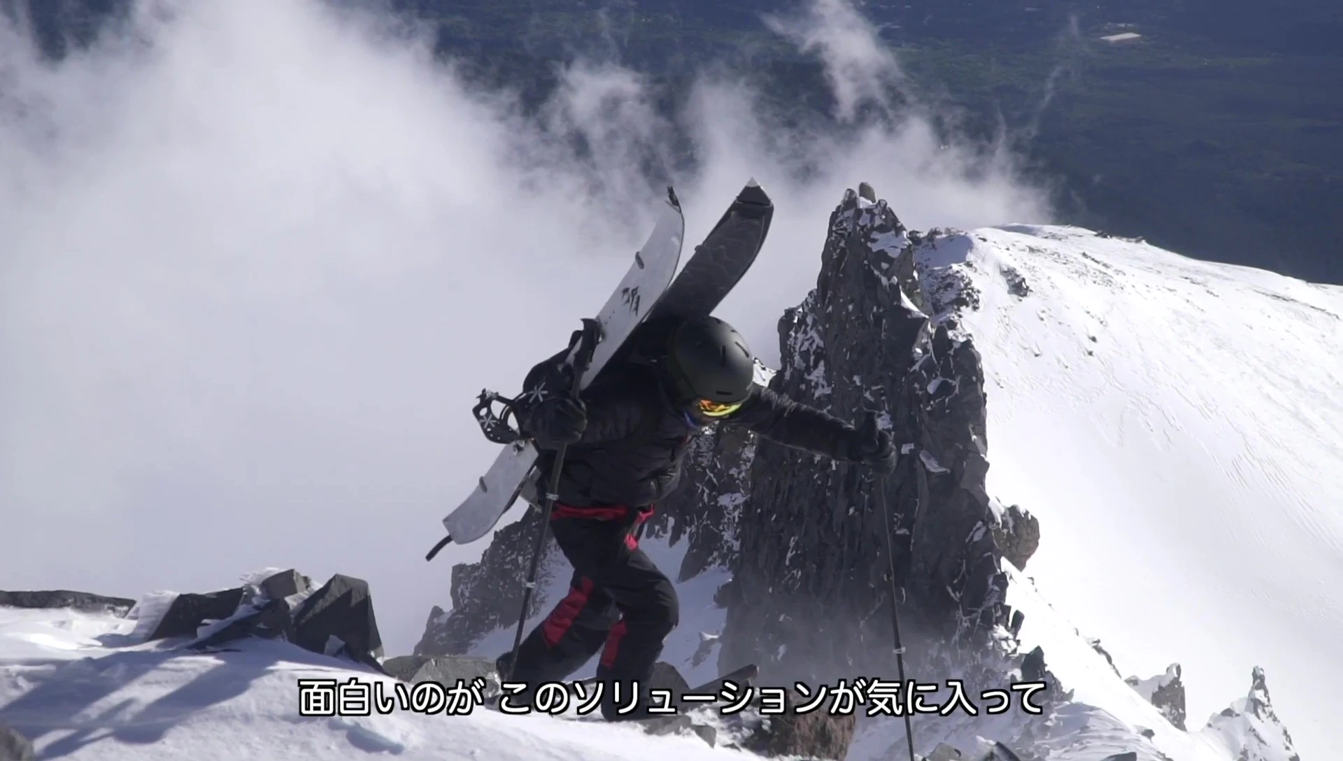 Rider holding the Jones Solution snowboard