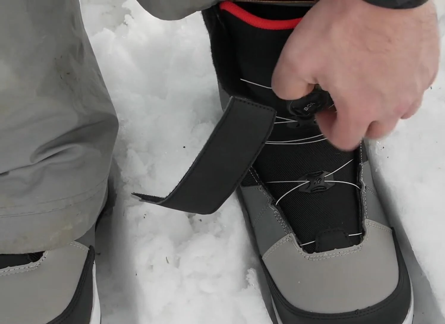 Action shot demonstrating the responsiveness and control offered by the K2 Clicker X system during various snowboarding maneuvers.