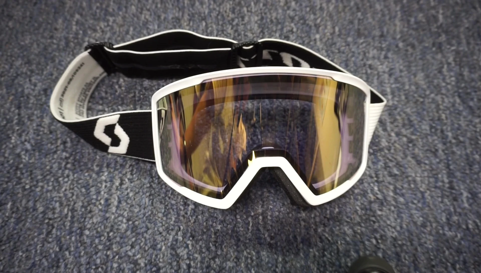 Final shot of the reviewer holding up the goggles.