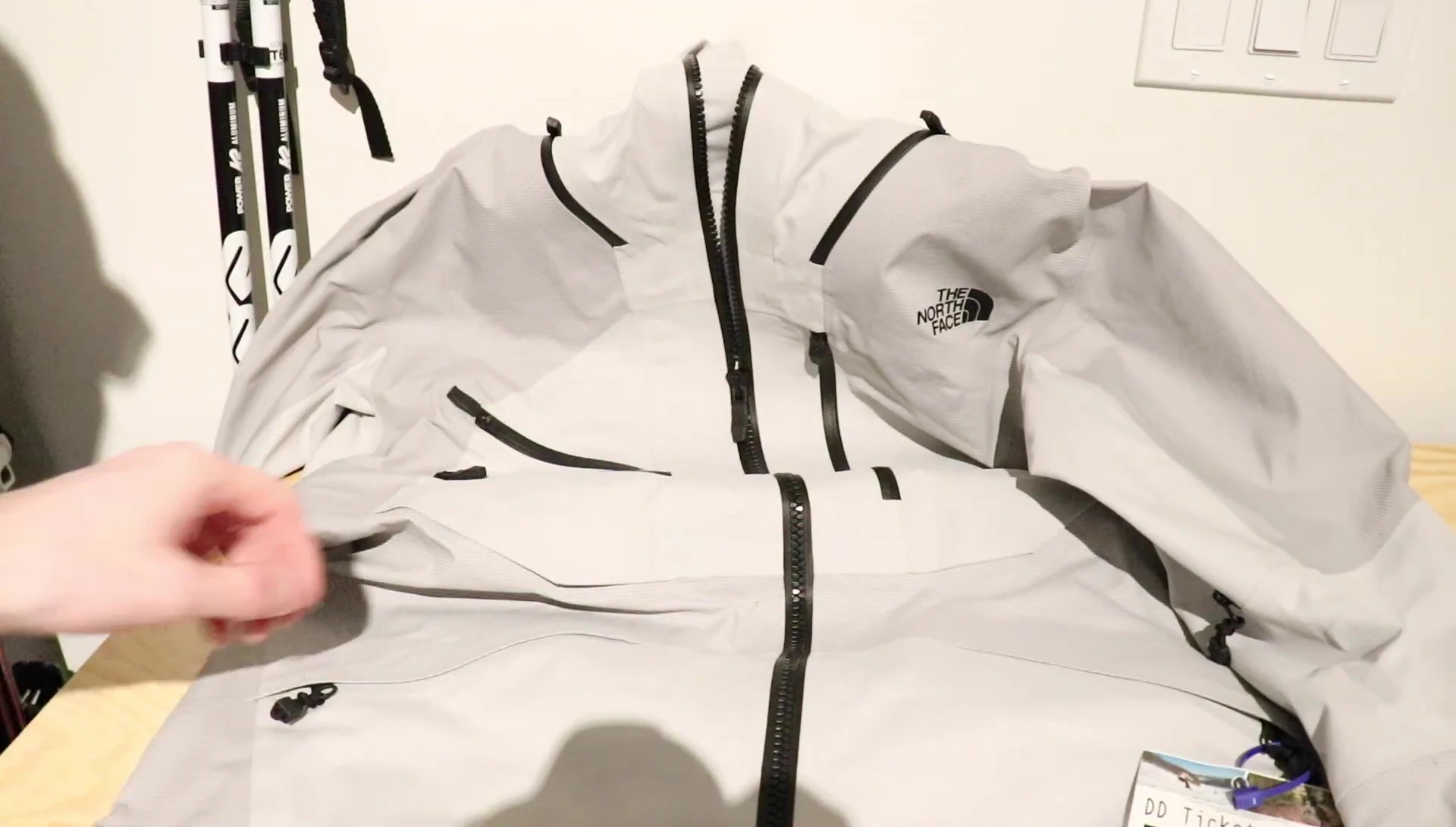 Showcasing the welded zipper details on the jacket pockets