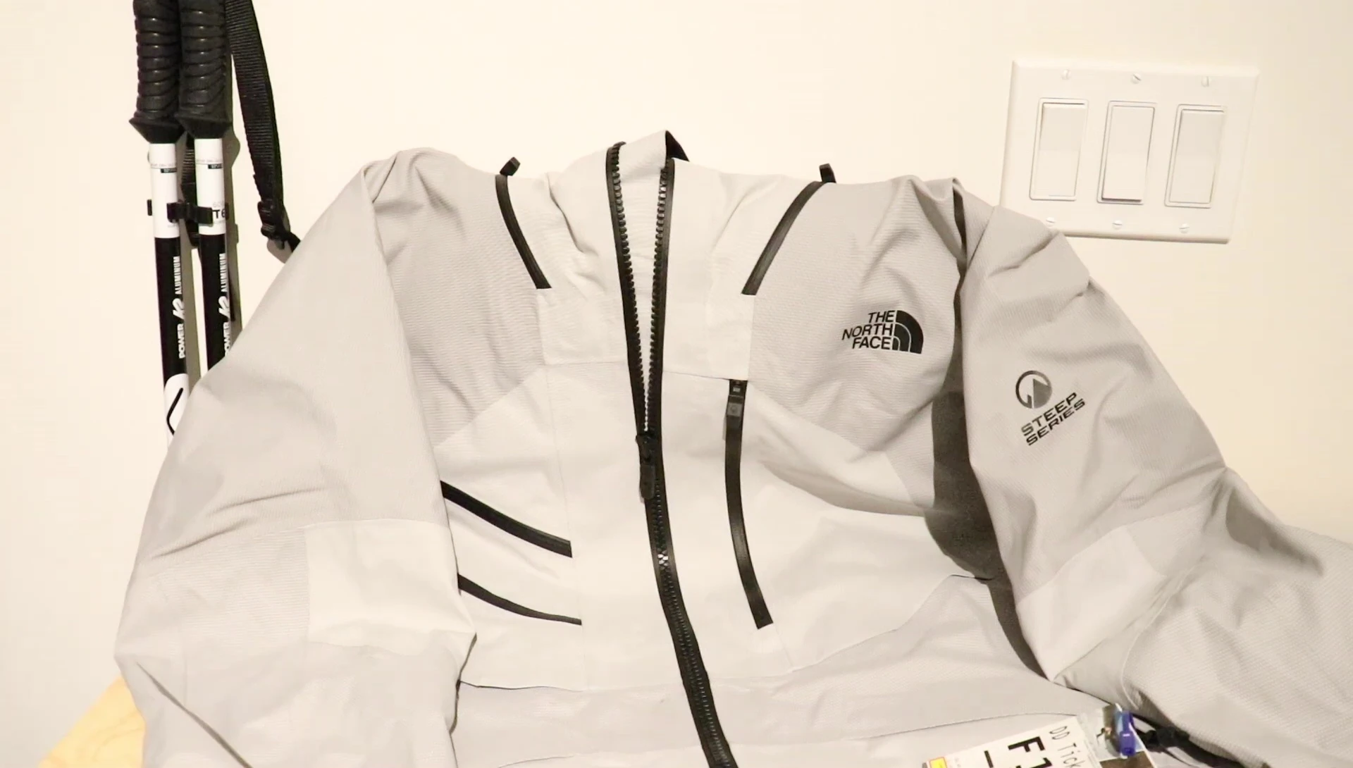 Text overlay mentioning the updated North Face Brigandine Futurelight jacket